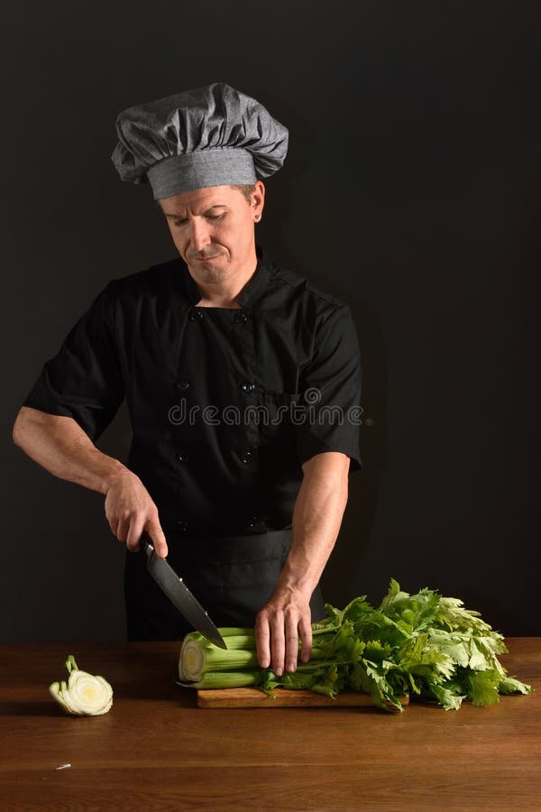 Chef chopping a celery stock photo. Image of caucasian 176077364