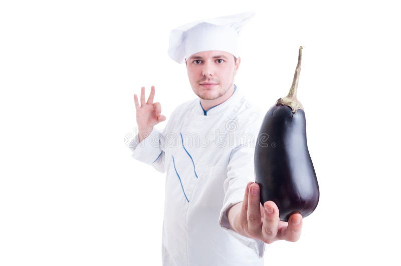 Chef or Cook Holding an Eggplant and Showing Perfect Gesture Stock