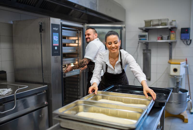 Chef and Cook Working on Their Dishes Indoors in Restaurant Kitchen
