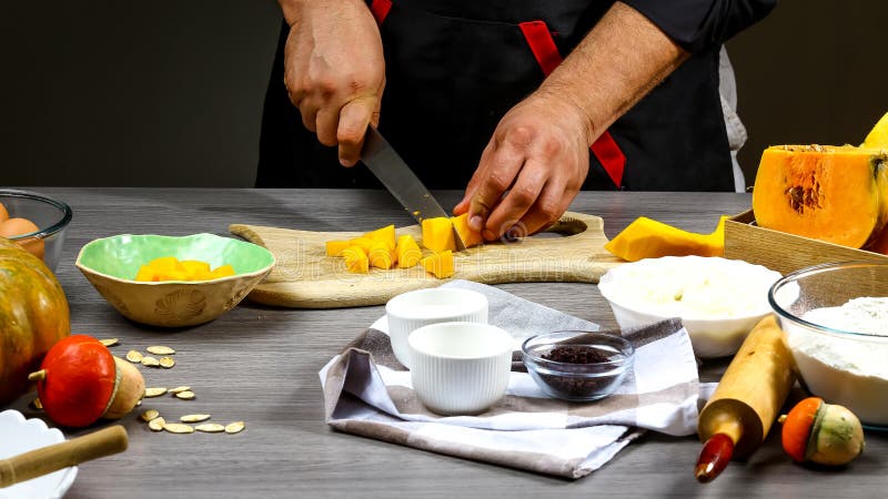 Chef cooking American pumpkin pie. Food concept background stock photography Chef cooking American pumpkin pie. Food concept background stock photography