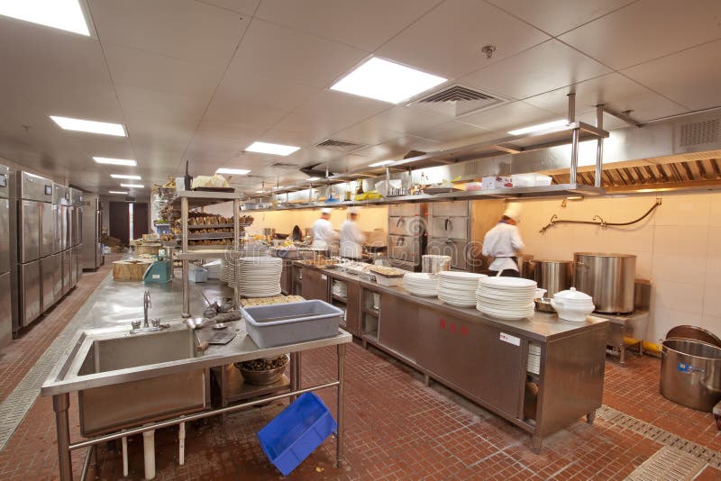 Chef cooking at commercial kitchen royalty free stock image