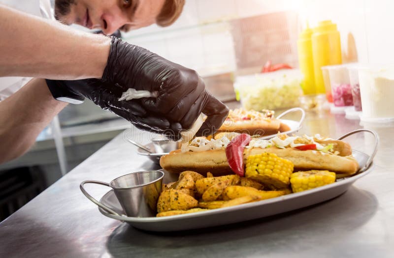 The Chef Cooking Hot Dog on a Grill. Restaurant Stock Photo Image of