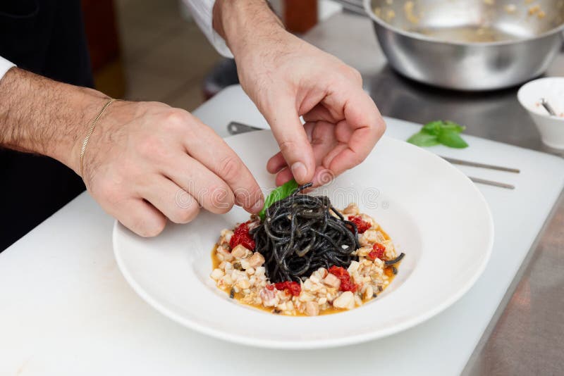 Cooking Chef In The Kitchen Holding Dish Of Pasta Stock Image Image