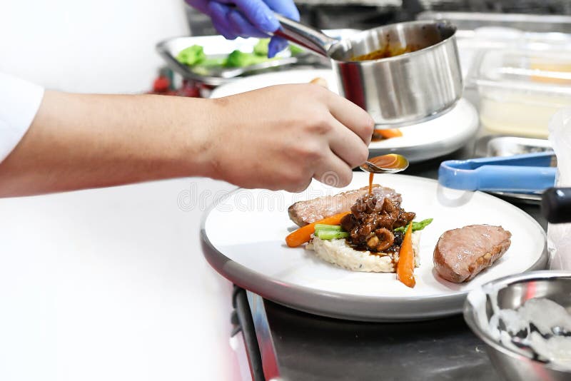 Chef Cooking, Chef Preparing Food in the Kitchen, Chef Decorating Dish
