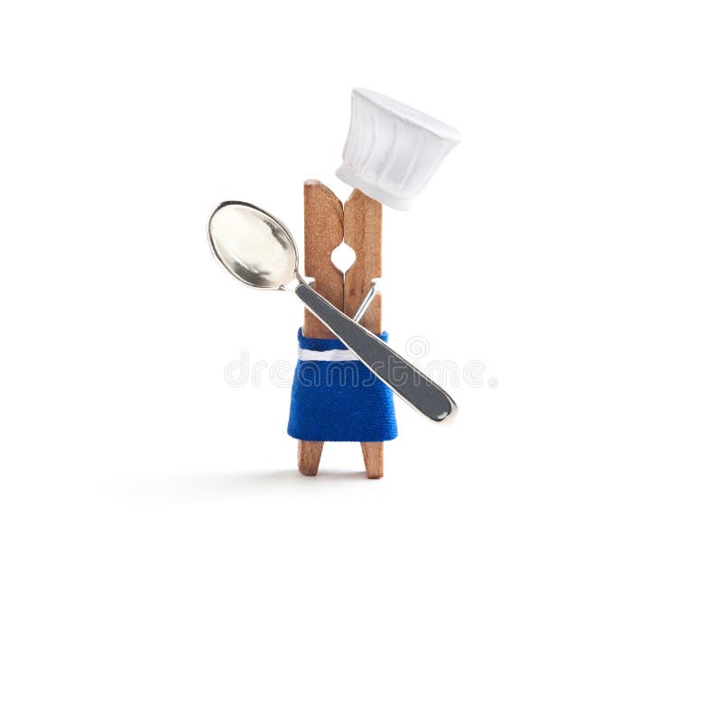 Chef cooking with spoon on white background. Funny clothespin restaurant character dressed in hat, blue apron. Kids menu stock photos Chef cooking with spoon on white background. Funny clothespin restaurant character dressed in hat, blue apron. Kids menu stock photos