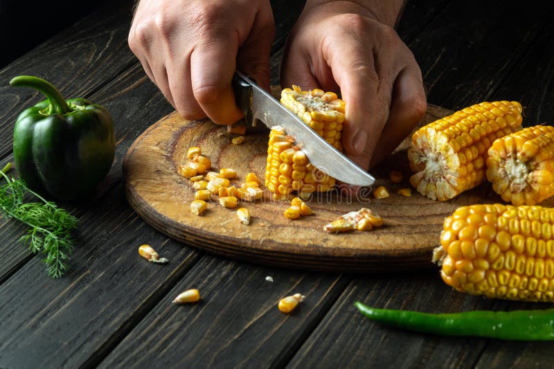 The Chef Cuts Corn with a Knife. Maize is an Excellent Dietary