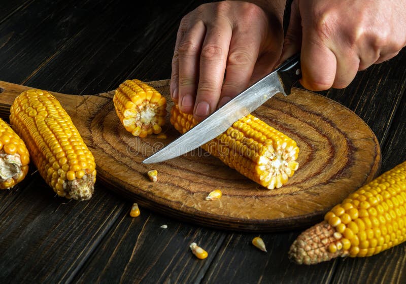 The Chef Cuts the Grains of Corn with a Knife. Maize is an Excellent