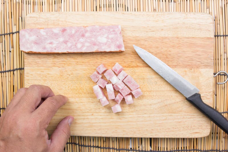 Chef cutting bacon for cooking fired rice