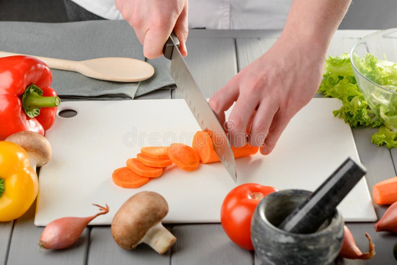 Cutting a Carrot into Circles Stock Photo - Image of circle, mushroom ...