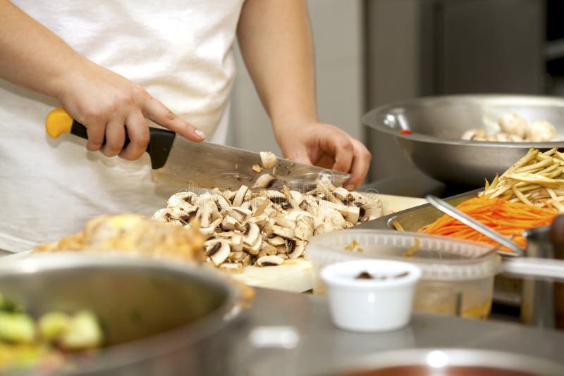 Chef cutting the mushrooms