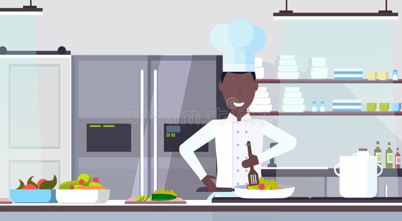 Chef d'afro-américain faisant cuire le cuisinier masculin de plat préparant la cuisine commerciale moderne de restaurant de conce