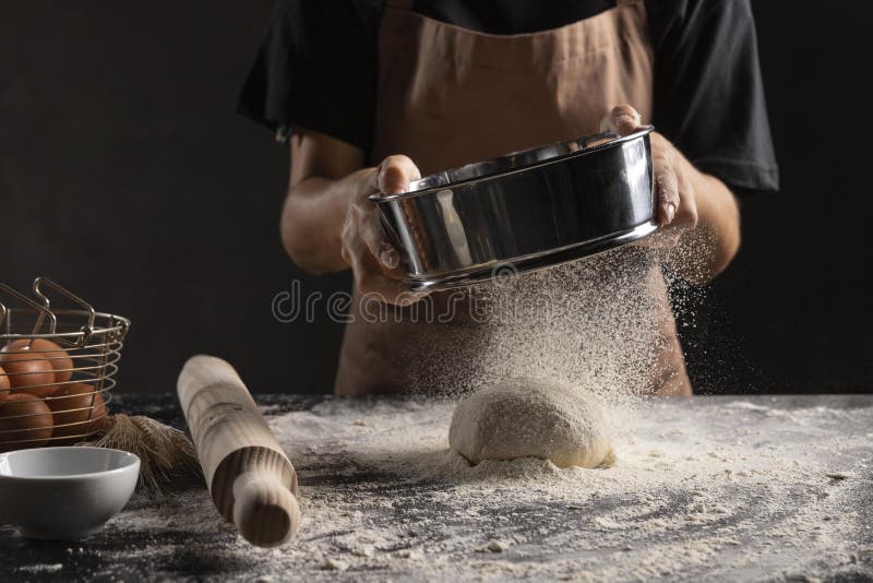 Chef Dusting Flour Dough. High Quality and Resolution Beautiful Photo