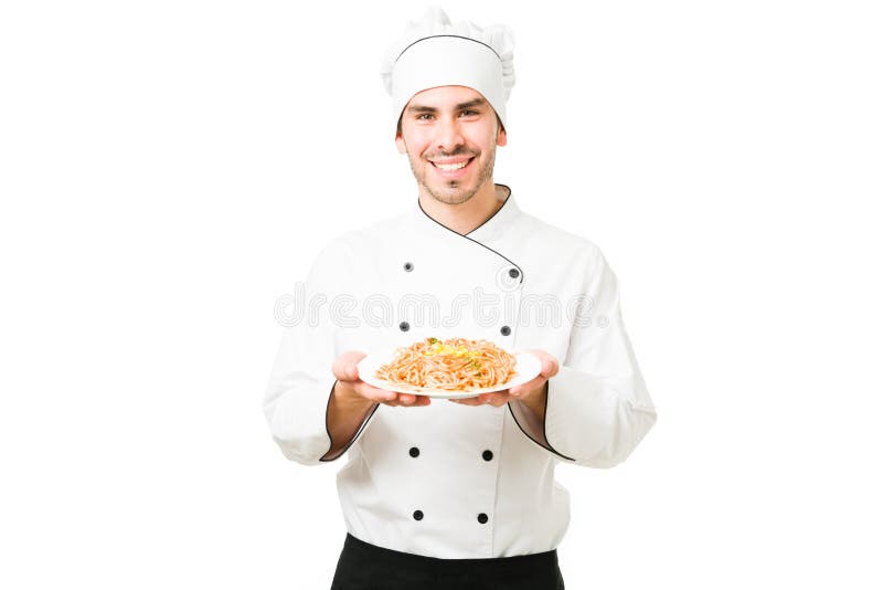 Chef Finishing the Dinner of a Customer at the Kitchen Restaurant Stock ...