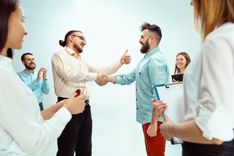 Boss approving and congratulating young successful employee of the company for his successes and good work. National Employee Appreciation Day, businesswoman, businessman, business, success, admire, career growth concept. Boss approving and congratulating young successful employee of the company for his successes and good work. National Employee Appreciation Day, businesswoman, businessman, business, success, admire, career growth concept.