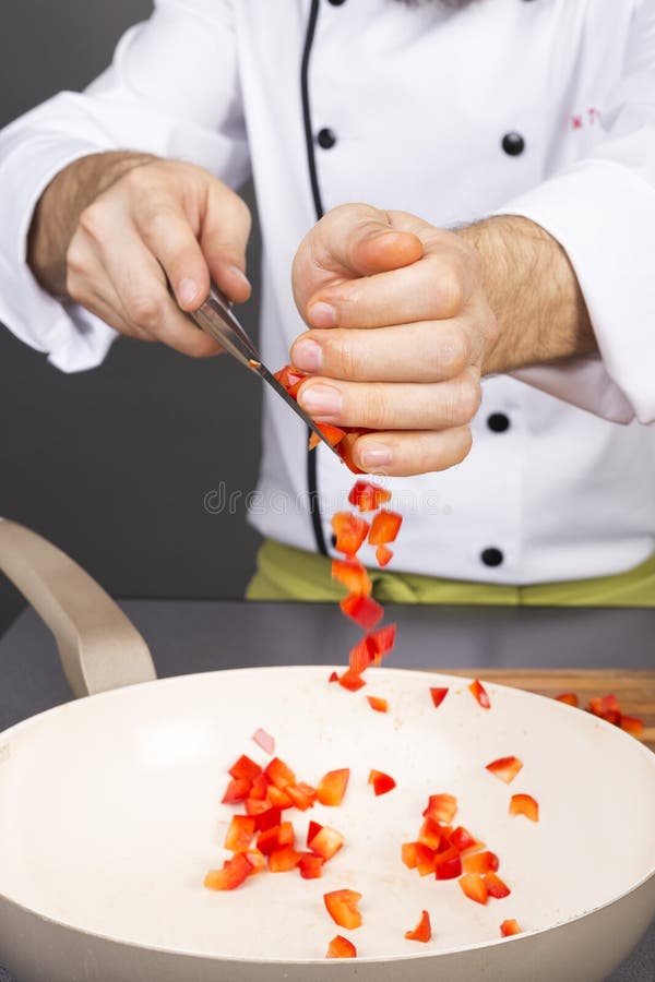Chef Hands Putting Chopped Red Pepper in a Pan Stock Photo Image of