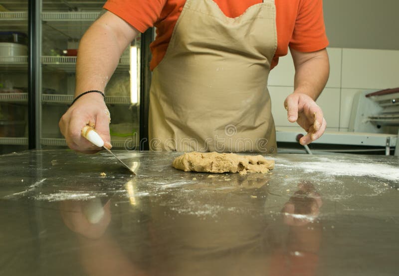 The Process of Making Bread. the Chef Kneads the Dough by Hand Stock