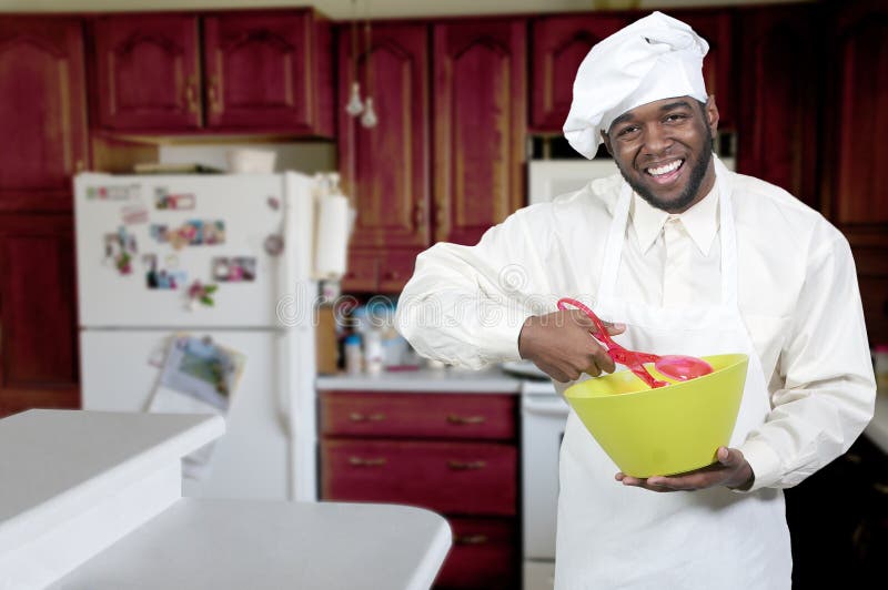 Black African American male chef showing his approval of the taste of food. Black African American male chef showing his approval of the taste of food