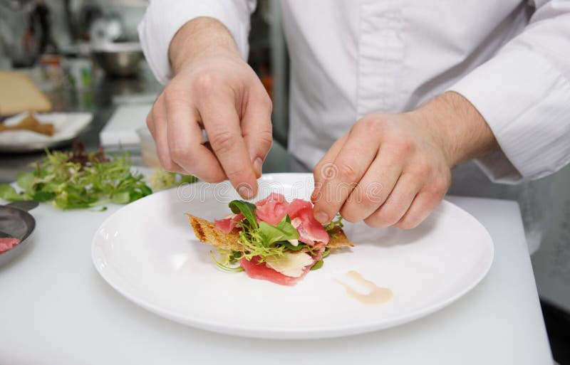 Chef is making appetizer stock image