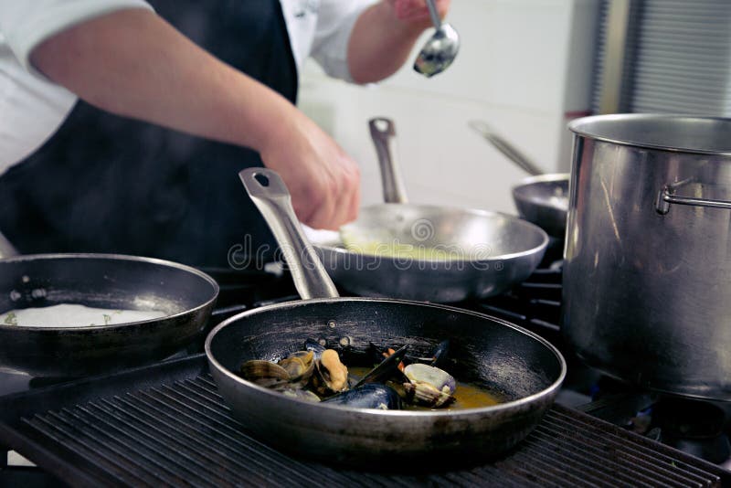 Chef is Making a Saute of Mussels Stock Photo Image of hands