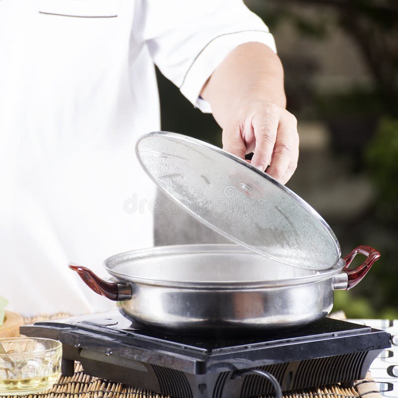 Chef Opening the Lid of Pot before Cooking Noodle Stock Photo Image