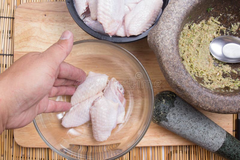 Chef Prepared Chicken Wings before Cooking with Seasoning Stock Photo