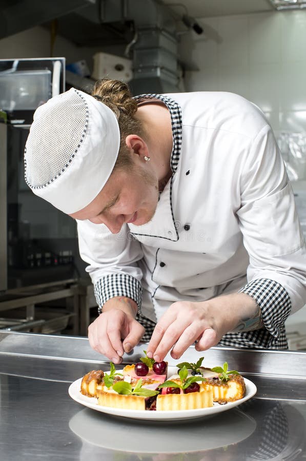 Chef prepares a meal stock photo. Image of middle, aged 37090138