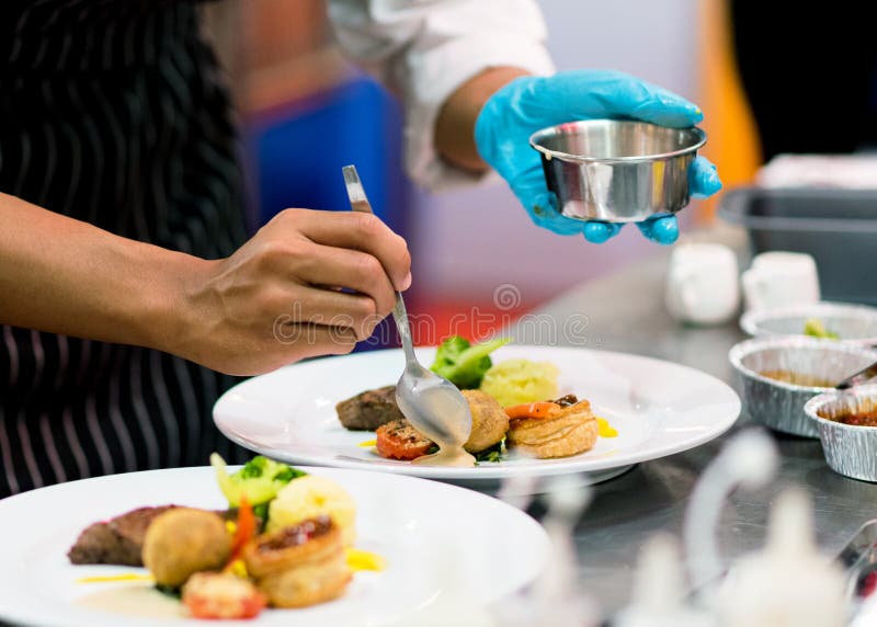 Chef Preparing Food in the Kitchen, Chef Cooking, Chef Decorating Dish Stock Photo Image of