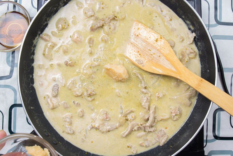 Chef Putting Cooconut Palm Sugar for Cooking Green Curry Stock Image
