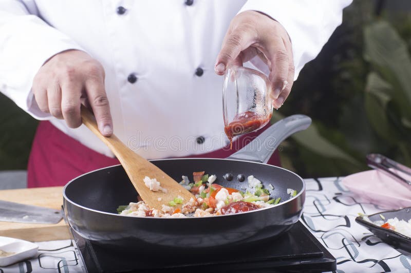 Chef Putting Tomato Sauce To the Pan for Cooking Stock Image Image of