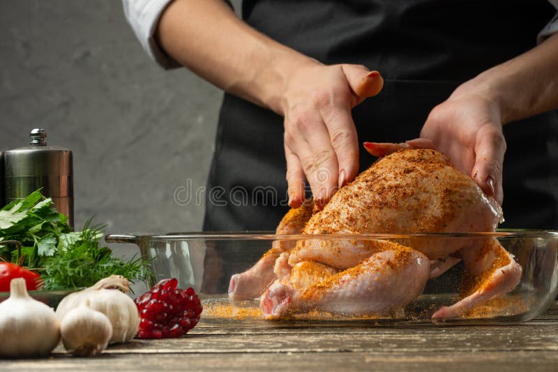 Chef rub chicken with fruit spices close up, background for recipe book, menu