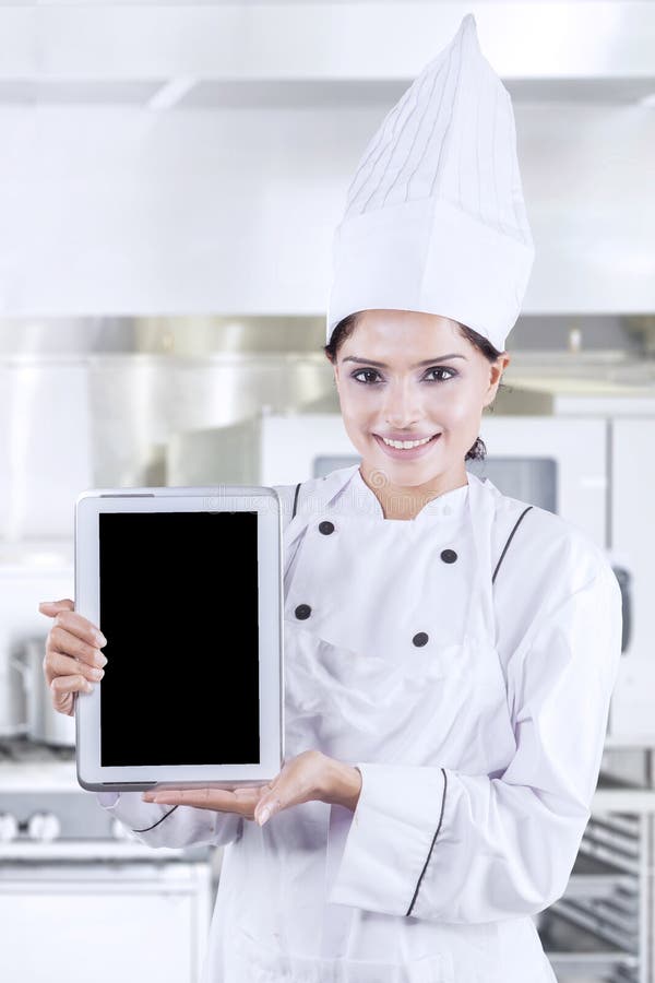Chef Showing Digital Tablet in the Kitchen Stock Photo Image of