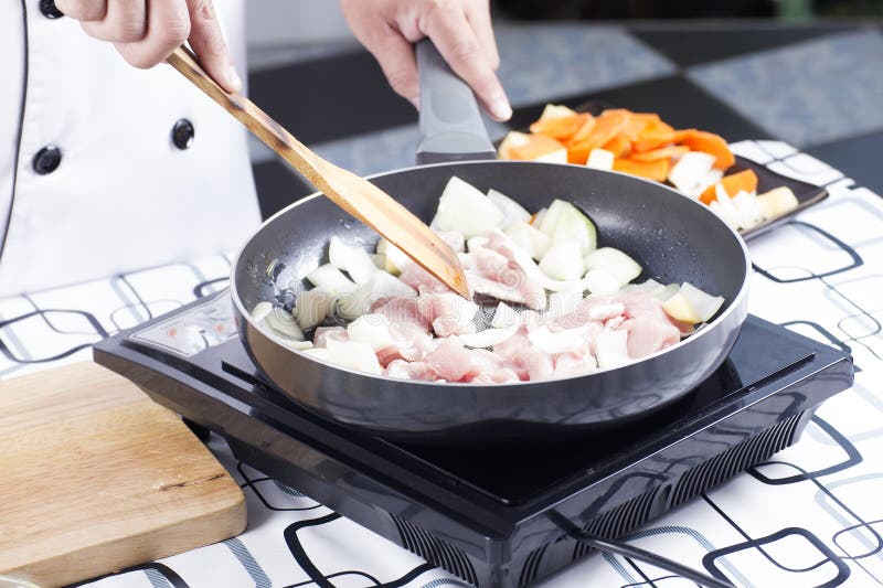 Chef Stir-fried Slice of Pork in the Pan for Cooking Japanese Po Stock