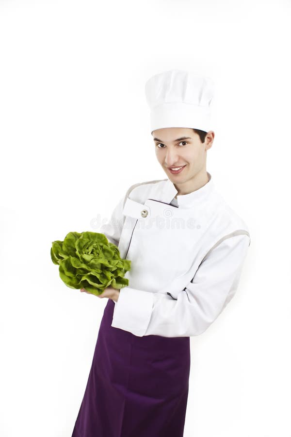 Chef with uniform and hat, holding lettuce royalty free stock photo Chef with uniform and hat, holding lettuce royalty free stock photo