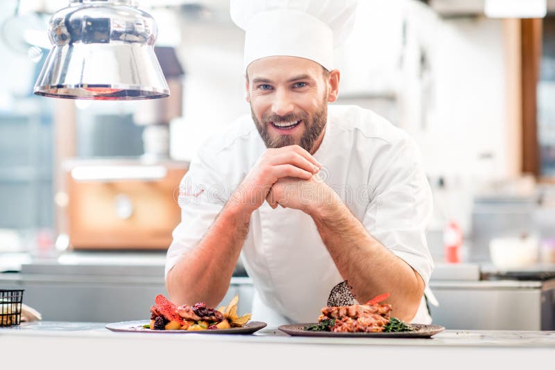 Portrait of chef cook in uniform with prepaired delicious dish at the restaurant kitchen. Portrait of chef cook in uniform with prepaired delicious dish at the restaurant kitchen