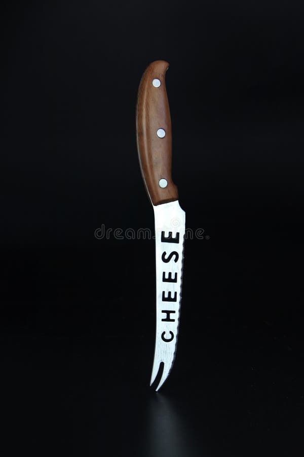 Chefs Knife for Cheese with Brown Handle. Kitchen Knife Balanced on Its
