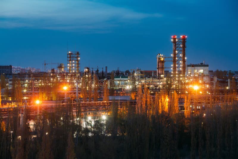 Chemical factory at summer night. Rectification towers stock photo