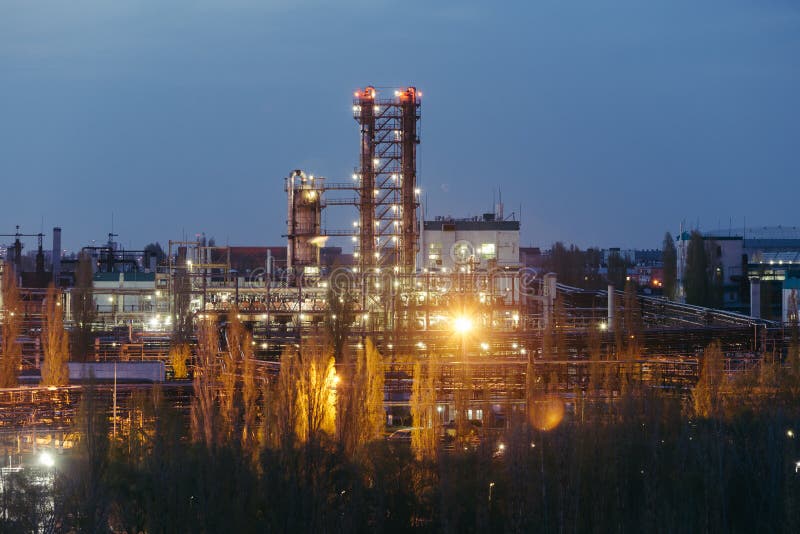 Chemical factory at summer night. Rectification towers royalty free stock image