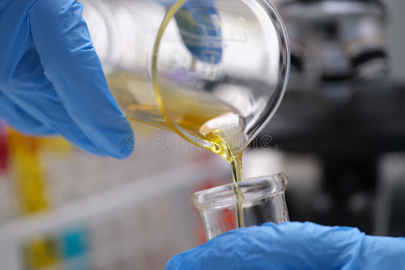 Chemical Laboratory Research and Liquid Oil Processing Closeup Stock