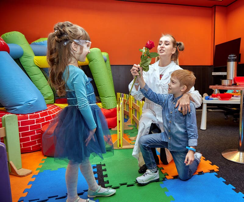 Chemical show for kids. Professor carried out chemical experiments with liquid nitrogen on Birthday little girl. stock photography Chemical show for kids. Professor carried out chemical experiments with liquid nitrogen on Birthday little girl. stock photography