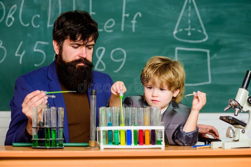 Chemical experiment. Achieving developmental milestones way before predicted sign that child ready to be challenged. Genius minds. Genius toddler private lesson. Genius kid. Teacher child test tubes. Chemical experiment. Achieving developmental milestones way before predicted sign that child ready to be challenged. Genius minds. Genius toddler private lesson. Genius kid. Teacher child test tubes.