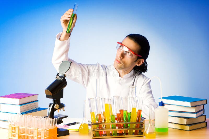 Chemist experimenting with solutions stock photo