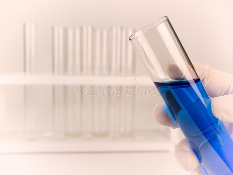 Chemist holding a test-tube royalty free stock photo Chemist holding a test-tube royalty free stock photo