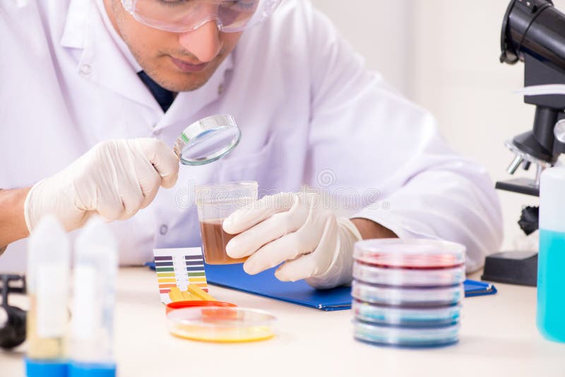 The Chemist in the Lab Checking with Ph Strips Stock Image Image of
