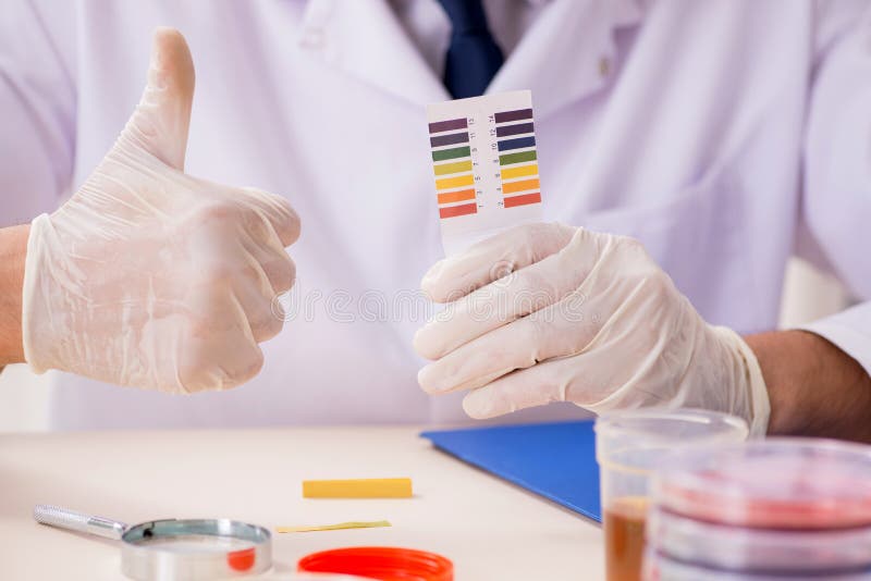 The Chemist in the Lab Checking with Ph Strips Stock Image Image of