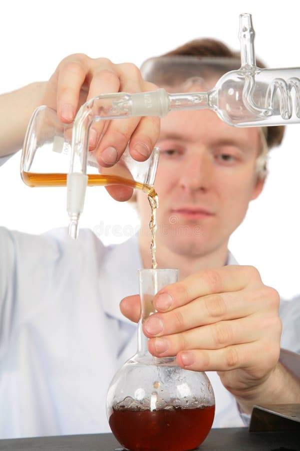 Chemist pours brown liquid in flask