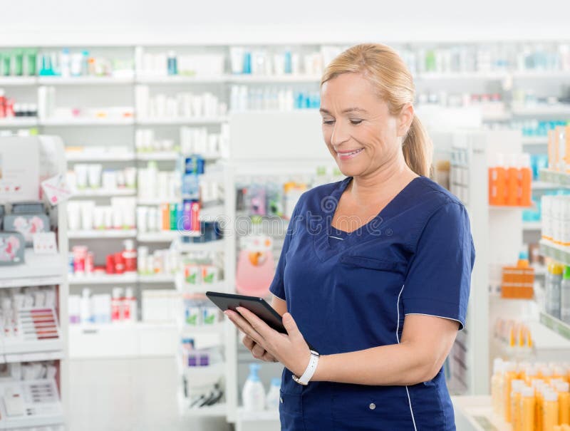 Chemist Using Digital Tablet in Pharmacy Stock Image Image of