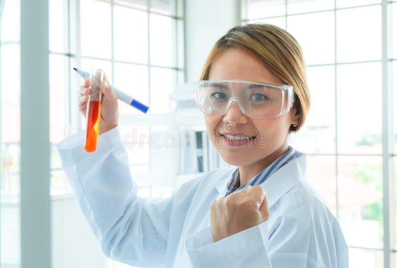Chemistry Teacher Writing Science and Chemical Formula on Whiteboard in
