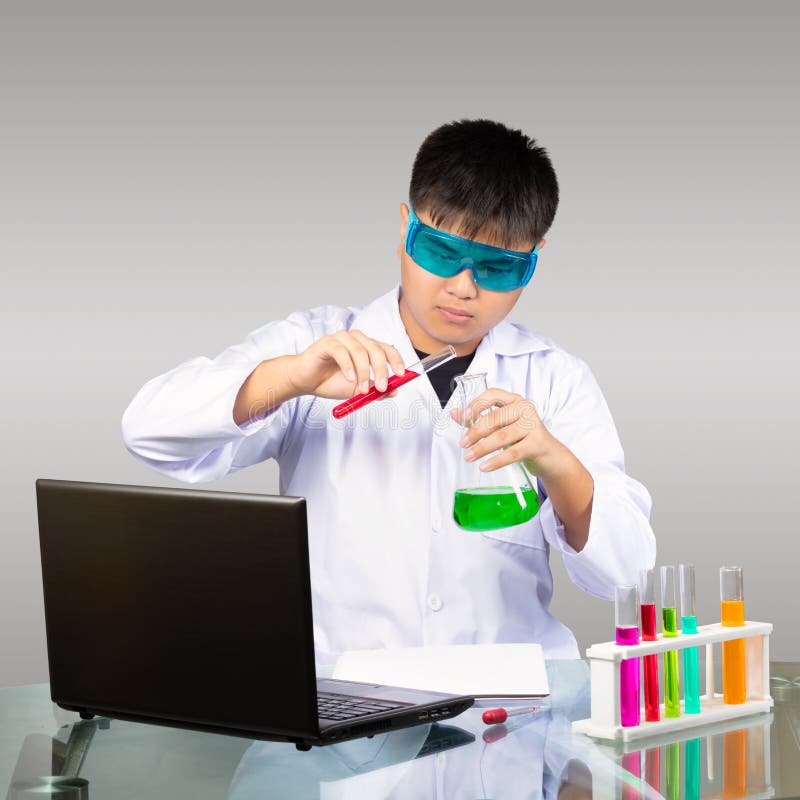 Young asian boy study chemistry