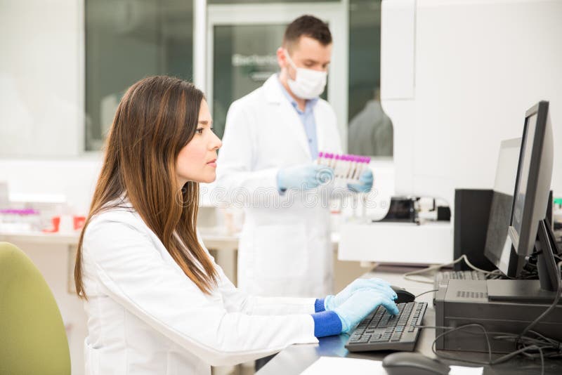 Chemist Running Blood Tests in a Lab Stock Photo Image of label