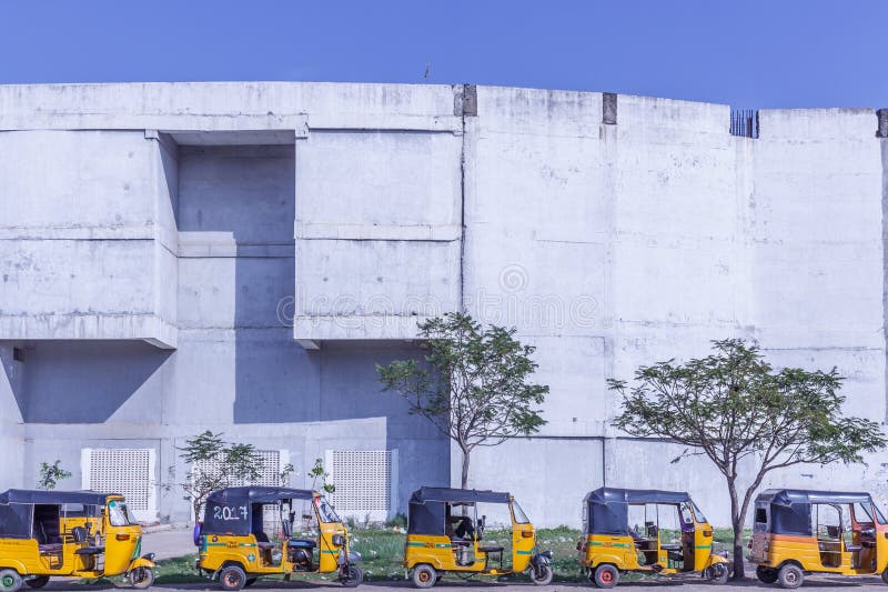 Chennai, India, 02.01.2017. Local auto rickshaw stand parked in a row outside Taramani railway station royalty free stock image Chennai, India, 02.01.2017. Local auto rickshaw stand parked in a row outside Taramani railway station royalty free stock image